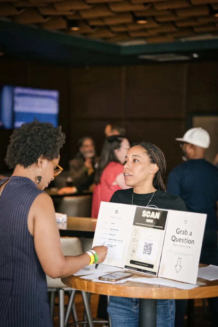 A conversation between Small Talk guests at Moxies
