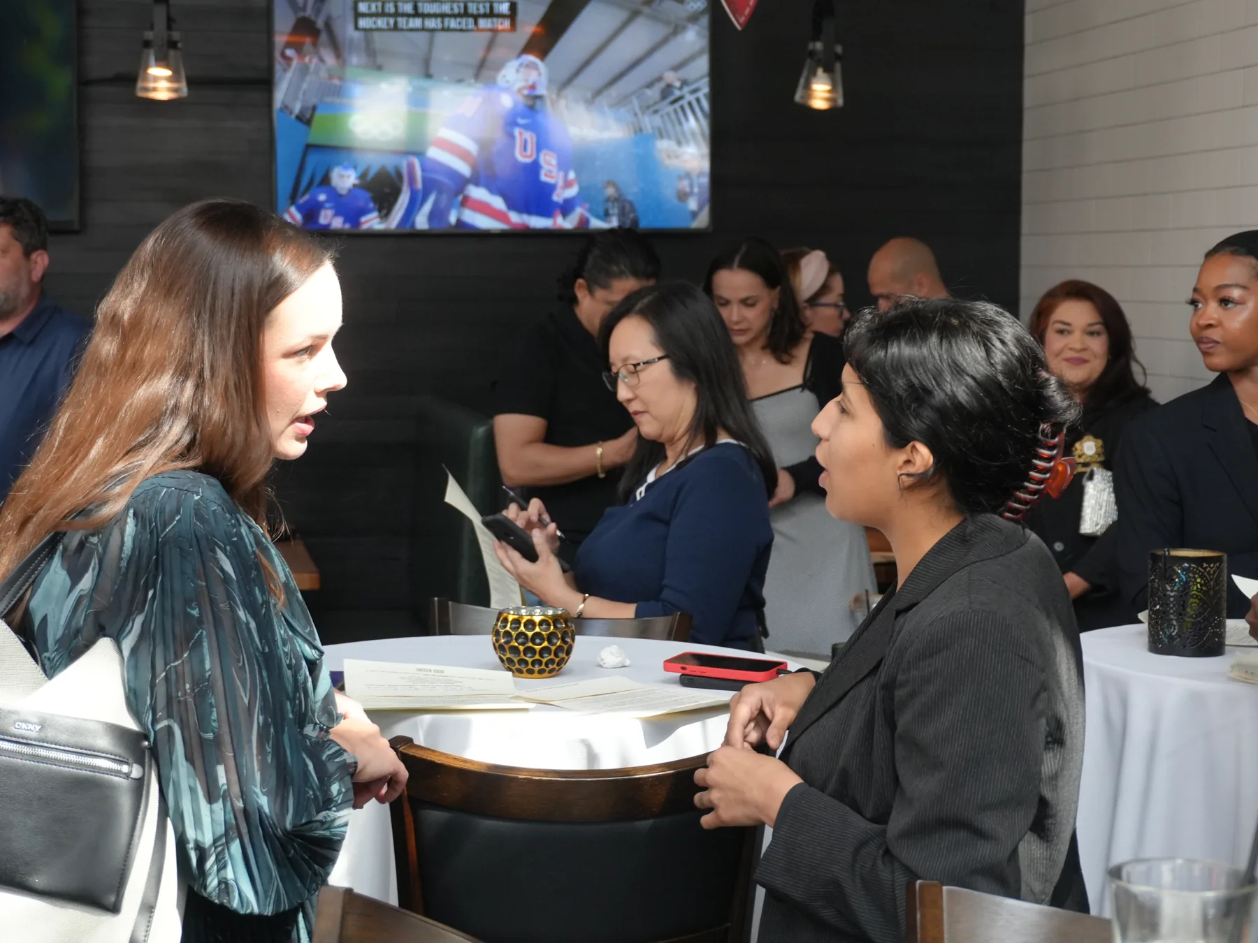 Guests connecting in conversation at a Small Talk gathering