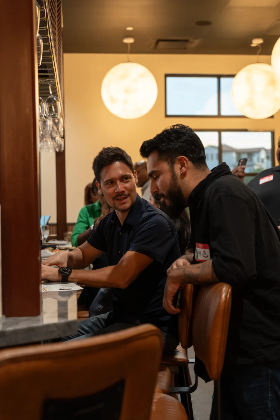 Guests talking at the City Cellars bar during Small Talk